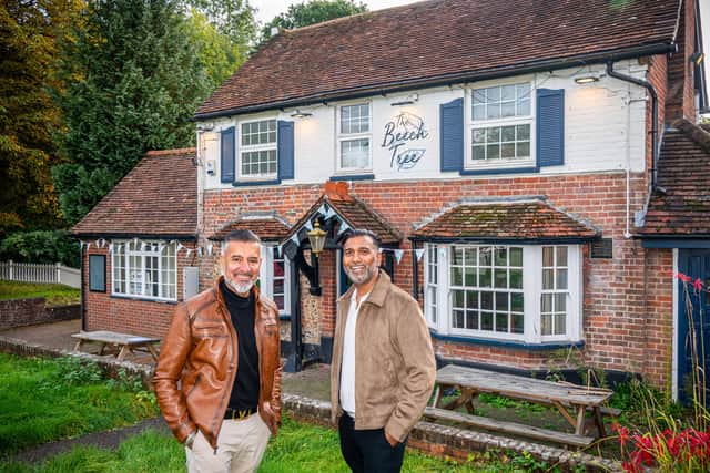 New operators, Bups Chaggar and Denis Gill outside closed pub