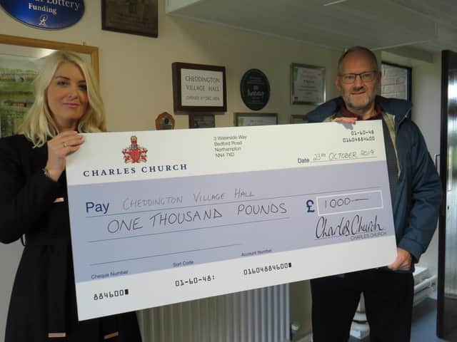 Persimmon Homes Midlands sales director Claire Dearsley presents Community Champions funding to Cheddington Village Hall
