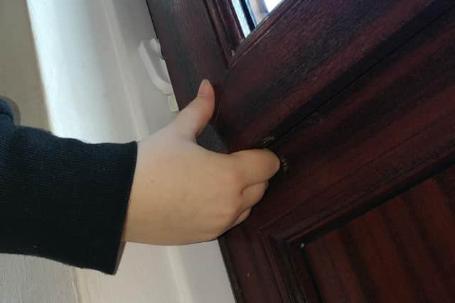 Tenant demonstrates they're able to fit their fingers under the 'closed' window