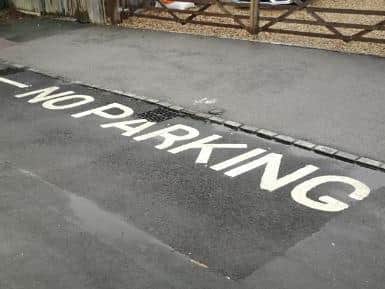 No parking is painted on the road surface in Hazell Avenue