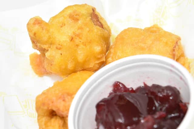 The battered sprouts are served with a cranberry dipping sauce