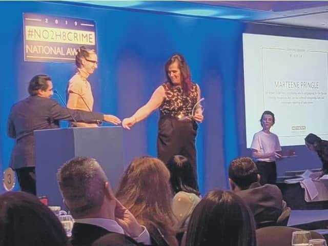 Marteen Pringle accepting an award at the no to hate crime awards this year