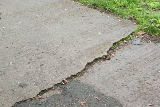 2 inch rise across the width of the path outside Waterside House