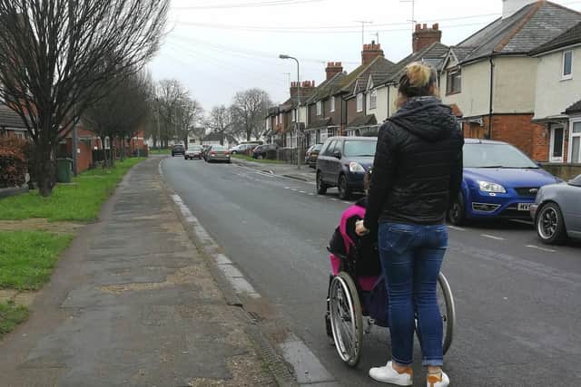 Kirsten and Marianne have to travel on the road to reach a drop curb