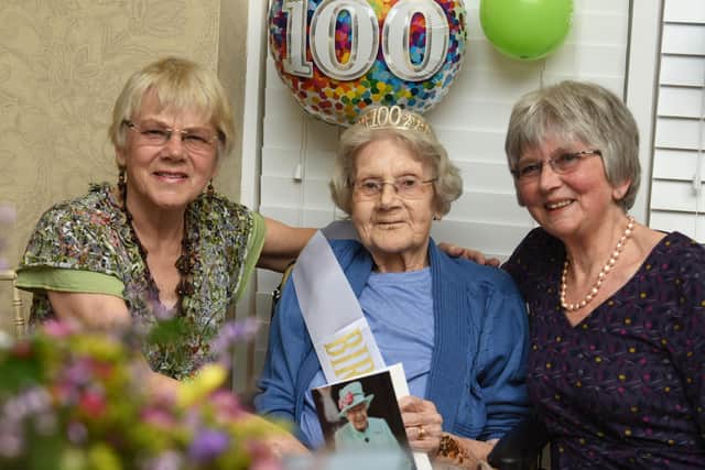 Joan with her two daughters on her 100th birthday