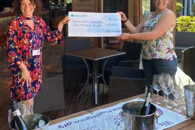 On the right, Kate Smith, The Akemans GM, handing over their donation to Claire Redrup, Rennie Grove Hospice Cares Community & Events Fundraising Manager