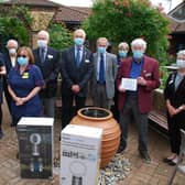 1) Pictured in the Hospice garden (L-R) are the Day Hospice Nurse Tracy Batt, Hospice Charity Chief Executive Jo Turner, Rotary District Secretary Leslie Robertson, Liz Monaghan Hospice Matron, Lees Fell and Rob Kernot President and Past President of Aylesbury Hundreds RC, Brian Hurst and Lindsey Fealey President and Secretary of Buckingham RC, Paul Denton Global Grant Chairman presenting the donation plaque with the Past District Governor of Rotary Mary Whitehead.