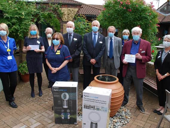 1) Pictured in the Hospice garden (L-R) are the Day Hospice Nurse Tracy Batt, Hospice Charity Chief Executive Jo Turner, Rotary District Secretary Leslie Robertson, Liz Monaghan Hospice Matron, Lees Fell and Rob Kernot President and Past President of Aylesbury Hundreds RC, Brian Hurst and Lindsey Fealey President and Secretary of Buckingham RC, Paul Denton Global Grant Chairman presenting the donation plaque with the Past District Governor of Rotary Mary Whitehead.