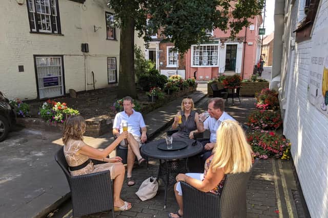 Visitors enjoying a drink in the new pedestrianised space in George Street.