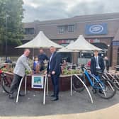 Photograph: The photo shows Cllr Steve Bowles (Aylesbury Garden Town Board Chairman), John Watson (Hale Leys Centre Manager) and Frank Bennet (Bennet Construction) behind, with students from St Michaels School making use of the cycle park.