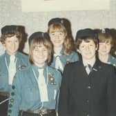 The Guides pictured with their Captain, Mrs. Joyce Parsons.