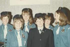 The Guides pictured with their Captain, Mrs. Joyce Parsons.