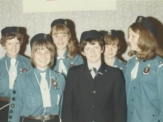 The Guides pictured with their Captain, Mrs. Joyce Parsons.
