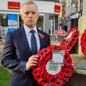 Aylesbury MP Rob Butler laying a wreath on Sunday