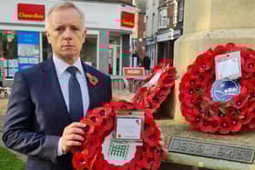 Aylesbury MP Rob Butler laying a wreath on Sunday