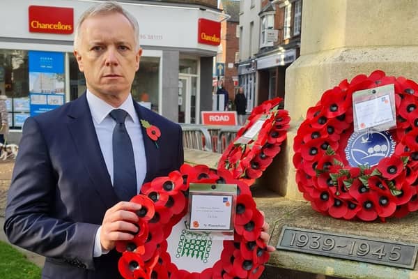 Aylesbury MP Rob Butler laying a wreath on Sunday