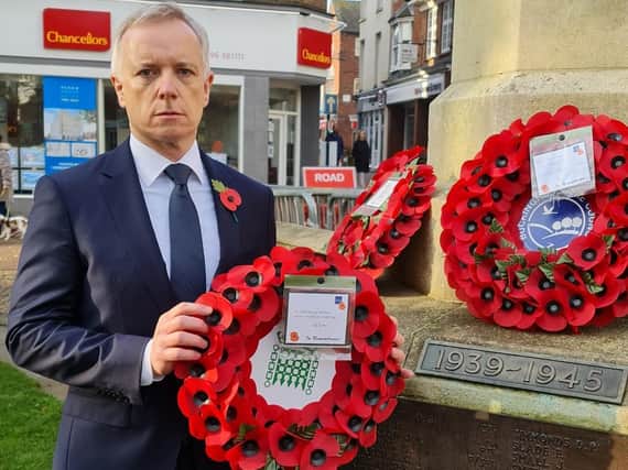 Aylesbury MP Rob Butler laying a wreath on Sunday