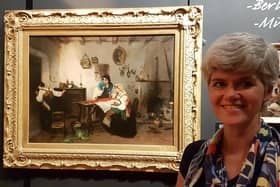 Melanie Czapski, Bucks County Museum Curator of Art, with 'A Scene from the Risorgimento’ by Italian artist Gerolamo Induno.