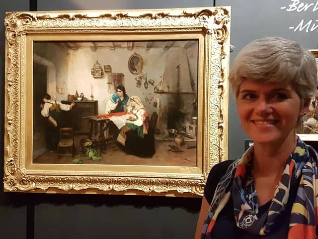 Melanie Czapski, Bucks County Museum Curator of Art, with 'A Scene from the Risorgimento’ by Italian artist Gerolamo Induno.