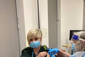 Jen Hall receiving her vaccination