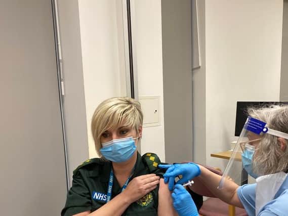 Jen Hall receiving her vaccination