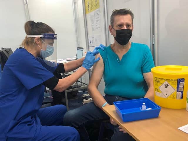 Pictured: Vaccinator Sarah Hyde gives a jab to David Bowen, a clinically extremely vulnerable patient, and one of the first to visit the new Large Scale Vaccination site at Buckinghamshire New University's Aylesbury campus this week.