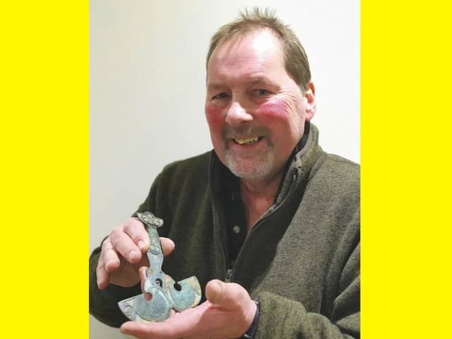 Ray Pusey with the brooch.