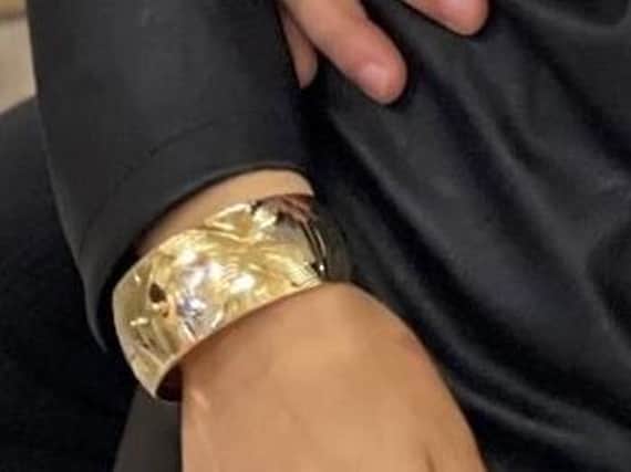 A picture of a stolen gold bracelet