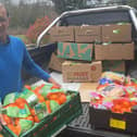 Cllr Arif Hussain delivering food parcels