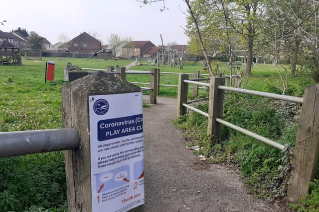A children's play area on Meadowcroft with a sign urging children not to use it