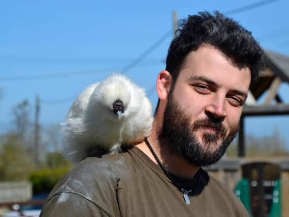 Bucks Goat Centre's head keeper Anthony with Nugget the silky chicken