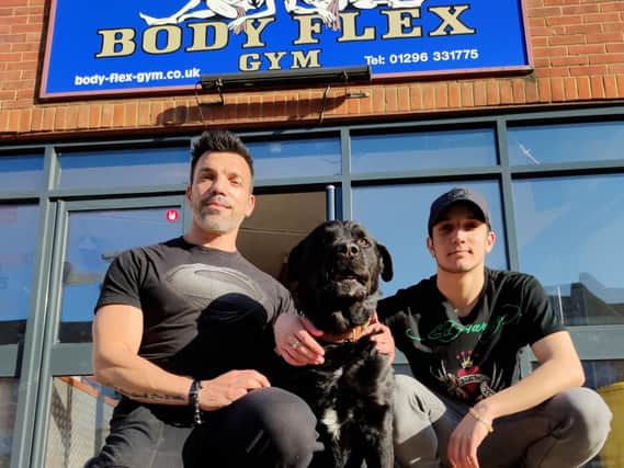 Tony with his son and Rocky the dog outside Body Flex gym