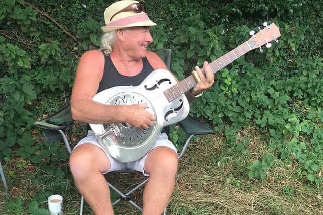 Neil with his guitar before he caught coronavirus