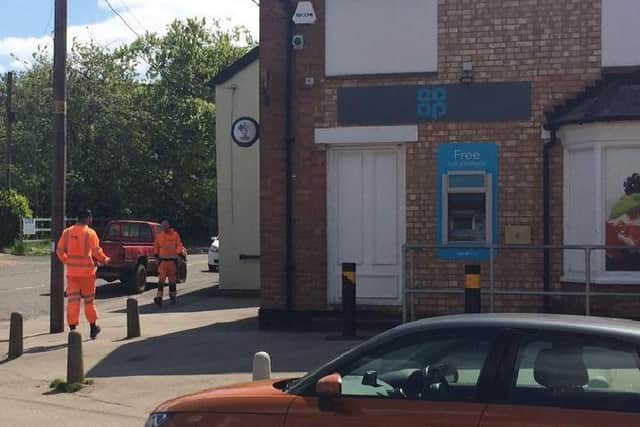 Construction workers in Steeple Claydon before entering shops (5 May)