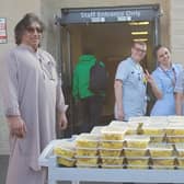 Staff at Stoke Mandeville gratefully receiving food donations before fighting covid-19