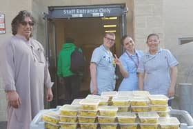 Staff at Stoke Mandeville gratefully receiving food donations before fighting covid-19