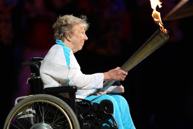 Margaret Maughan lighting the Olympic flame in 2012