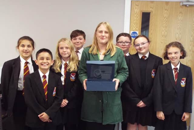 Head of Science Jo Pennington-Wright proudly displays the award with a group of Year 7 students who were attending an after school science workshop