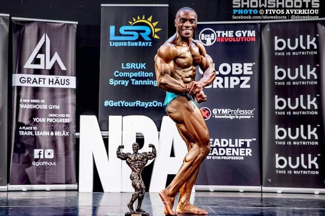 Vince Mwayi with his trophy on stage in Manchester