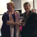 Mayor of Buckingham Margaret Gateley presents the trophy to team Town captain Jane Mordue