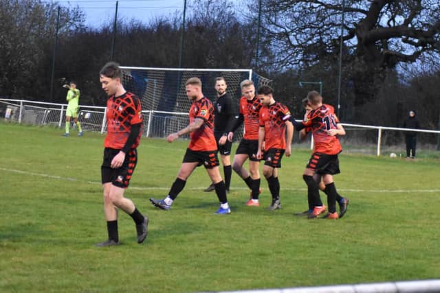 Captain Dave Brown and his team mates celebrate a goal in their 5-4 thriller