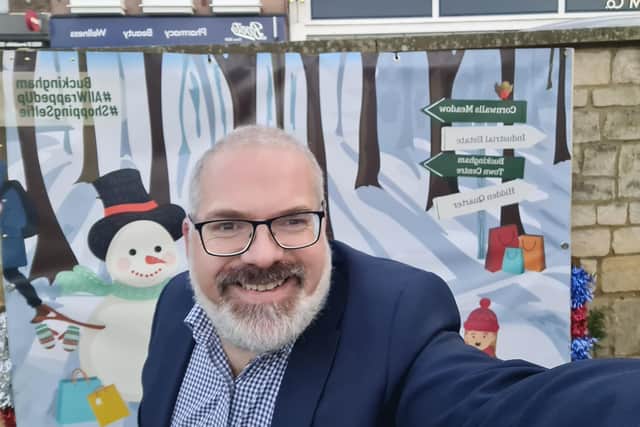Town clerk Paul Hodson tests out the selfie banner