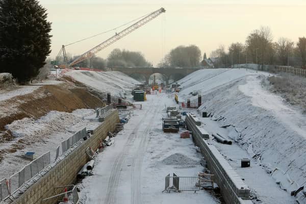 Platform foundations being laid in the snow at Winslow station
