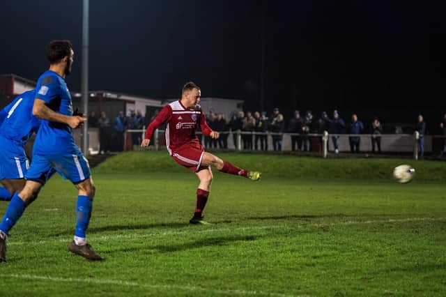 Marcus Mealing scoring Risborough Rangers’ 50th league goal of the season against Oxhey Jets in their 50th game unbeaten (Picture by Charlie Carter)
