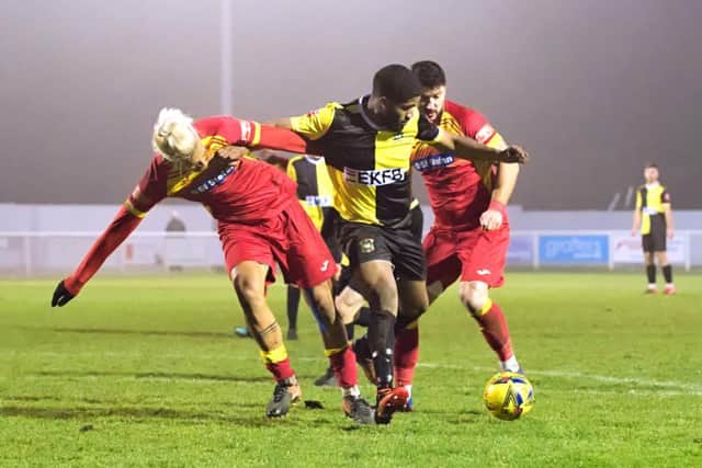 Aylesbury United scorer Ezra Anthonio-Forde (who has returned to the Ducks after a short spell with North Leigh FC) battling in midfield with FC Romania (Pictures by Mike Snell)