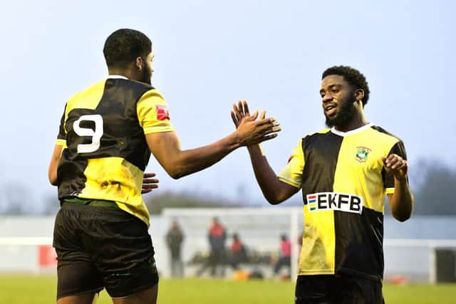 Ezra Anthonio-Ford (No. 9) celebrating his goal against FC Romania with Jaedon Phillips