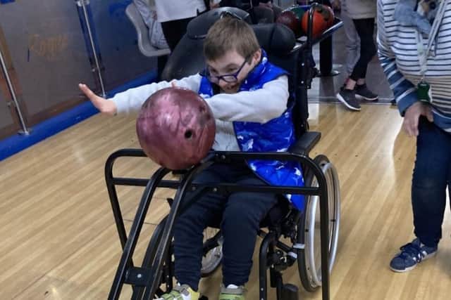A pupil from a SEND school who took part in a bowling event courtesy of Absolutely Together