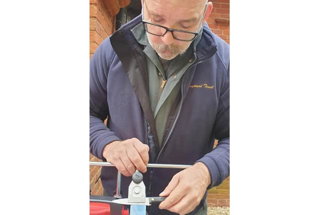 Rev Mark Nelson sharpens a knife at the St Laurence Repair Cafe