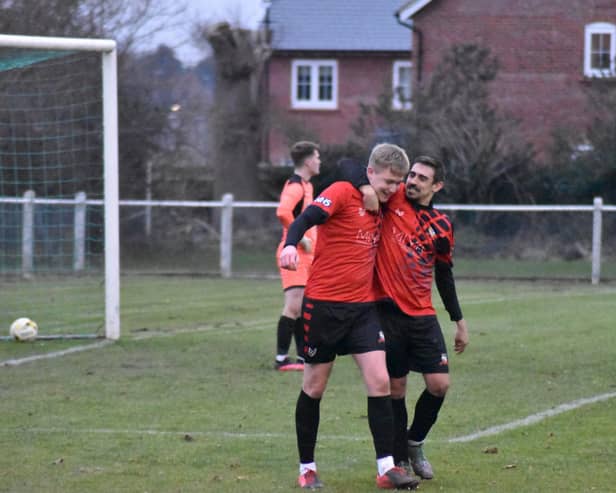 Scorer Jake Baldwin is congratulated by Chris Stapleton