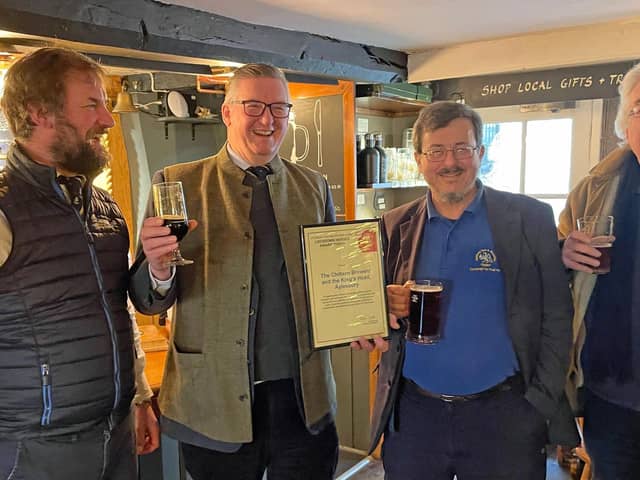 Pictured (left to right): Tom Jenkinson, George Jenkinson, Giles du
Boulay, David Roe (treasurer of the local CAMRA branch) in the Farmers’ Bar at the King’s Head.